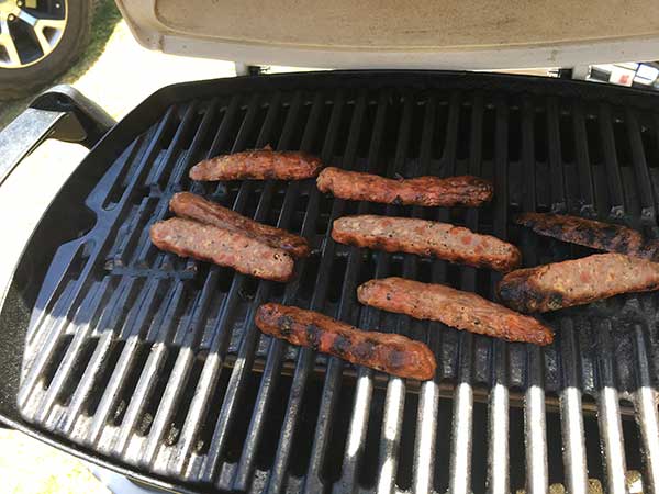 Slice the sausages and place on the grill and keep them there for a few minutes or until hot.