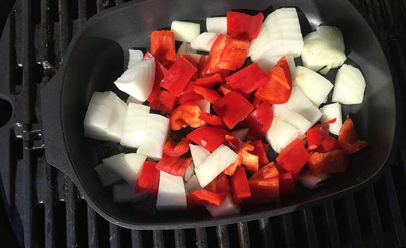 Heat olive oil in a pan and then add onion and capsicum - cook over medium heat until soft and tender.