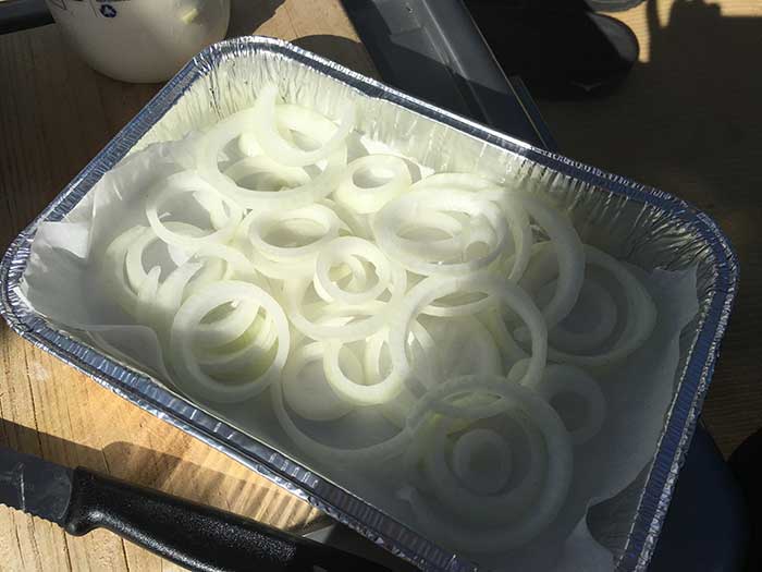 Layer the onions, potato into a foil container or oven proof dish.